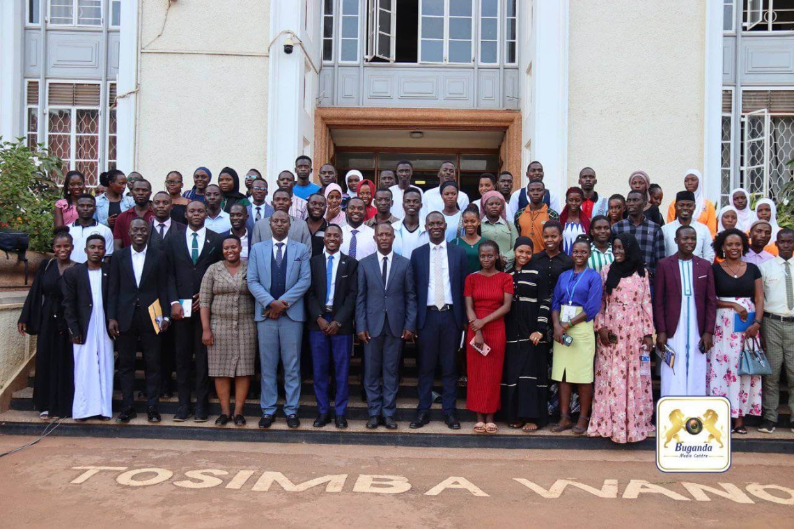 Nkobazambogo youth with Minister Owek. Robert Serwanga (7th from the left)